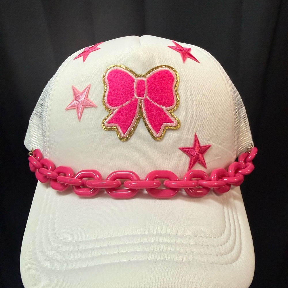 Pink bow baddie trucker hat